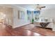 Bedroom showcasing hardwood floors, neutral walls, and a view into the hallway at 4901 W Estrella St, Tampa, FL 33629