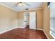 Inviting bedroom featuring hardwood floors, neutral walls, and a large closet at 4901 W Estrella St, Tampa, FL 33629