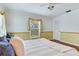 This bedroom offers natural light and neutral tones to create a relaxing atmosphere at 4901 W Estrella St, Tampa, FL 33629