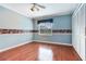 Bright bedroom with hardwood floors, a closet, a ceiling fan, and natural light from a window at 4901 W Estrella St, Tampa, FL 33629