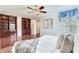 Bedroom with hardwood floors, built-in shelving, and large window with natural light at 4901 W Estrella St, Tampa, FL 33629