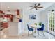 Charming breakfast nook featuring a bright decor, modern lighting and a door leading to the outdoors at 4901 W Estrella St, Tampa, FL 33629