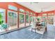 Bright dining room with oversized windows, tile floor, and ceiling fan for a relaxing, comfortable atmosphere at 4901 W Estrella St, Tampa, FL 33629