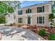 Charming home featuring decorative shutters and beautifully landscaped surroundings at 4901 W Estrella St, Tampa, FL 33629
