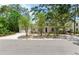 Inviting home exterior with a lush green lawn and mature trees at 4901 W Estrella St, Tampa, FL 33629