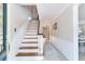 Bright entryway with wood staircase and tile flooring at 4901 W Estrella St, Tampa, FL 33629