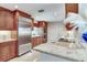 Modern kitchen featuring stainless steel appliances, granite countertops, and plenty of cabinet space at 4901 W Estrella St, Tampa, FL 33629