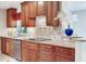 Well-appointed kitchen featuring granite countertops, stainless steel appliances, and tiled backsplash at 4901 W Estrella St, Tampa, FL 33629