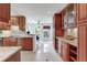 Bright kitchen with granite countertops, tile backsplash, and stainless steel appliances with wood cabinets at 4901 W Estrella St, Tampa, FL 33629