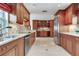 Spacious kitchen with stainless steel appliances, granite countertops, and custom cabinetry at 4901 W Estrella St, Tampa, FL 33629