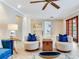 Spacious living room featuring neutral walls, tiled floors, and comfortable seating at 4901 W Estrella St, Tampa, FL 33629