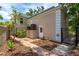 This exterior features a brick pathway with AC units and lush landscaping at 4901 W Estrella St, Tampa, FL 33629