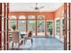 Bright sun room featuring a dining table, multiple windows, and tile floors at 4901 W Estrella St, Tampa, FL 33629