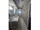 Bathroom featuring a large mirror, tiled floor, and a separate shower area at 534 N Larry Cir, Brandon, FL 33511