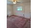 Bedroom with a ceiling fan and a window offering natural light at 534 N Larry Cir, Brandon, FL 33511