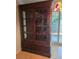 Elegant wood china cabinet with glass doors and drawers, perfect for displaying cherished items at 534 N Larry Cir, Brandon, FL 33511