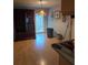 Dining area with sliding glass doors to the backyard and laminate flooring at 534 N Larry Cir, Brandon, FL 33511