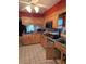Fully equipped kitchen with wood cabinets, modern appliances, and tiled backsplash at 534 N Larry Cir, Brandon, FL 33511