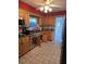 Functional kitchen with stainless steel appliances, tile floors, and ample cabinet space at 534 N Larry Cir, Brandon, FL 33511