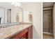 Bathroom featuring granite countertop vanity and framed glass shower enclosure at 5633 Puerta Del Sol S Blvd # 310, St Petersburg, FL 33715
