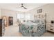 Bright bedroom featuring tile floors, ceiling fan, and waterfront view through large windows at 5633 Puerta Del Sol S Blvd # 310, St Petersburg, FL 33715