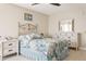 Bright bedroom featuring coastal-inspired decor, dresser, and natural light at 5633 Puerta Del Sol S Blvd # 310, St Petersburg, FL 33715