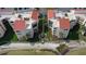 Aerial shot of condo buildings with red tile roofs, landscaping, and water views at 5633 Puerta Del Sol S Blvd # 310, St Petersburg, FL 33715