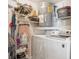 Functional laundry room with washer, dryer, water heater, and shelving at 5633 Puerta Del Sol S Blvd # 310, St Petersburg, FL 33715