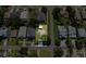 A high angle shot shows a neighborhood with tree lined streets and mature landscaping surrounding the homes at 7516 S Obrien St, Tampa, FL 33616