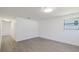 Bright, airy bedroom features light gray floors, fresh white paint and new fixtures at 7516 S Obrien St, Tampa, FL 33616