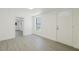 Bright entryway features modern gray floors, white trim and walls, door and a window at 7516 S Obrien St, Tampa, FL 33616