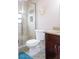 Bathroom features a glass shower, toilet, granite vanity, and modern fixtures at 7542 Armand Cir, Tampa, FL 33634