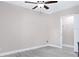 Bright bedroom with wood-look flooring and ceiling fan, offering a clean and airy space at 7542 Armand Cir, Tampa, FL 33634