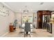 Open concept dining area with modern furnishings and views into the kitchen at 7542 Armand Cir, Tampa, FL 33634
