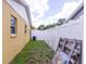 Side yard with privacy fence, offering a secure and private outdoor space at 7542 Armand Cir, Tampa, FL 33634