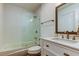 Clean bathroom boasts a tub and shower combination, a vanity with storage, and modern fixtures at 9481 Highland Oak Dr # 1308, Tampa, FL 33647