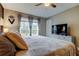 Bright bedroom with ceiling fan and large window with natural views at 9481 Highland Oak Dr # 1308, Tampa, FL 33647
