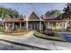 Community clubhouse featuring a welcoming entrance and well-maintained landscaping at 9481 Highland Oak Dr # 1308, Tampa, FL 33647