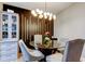 Cozy dining area featuring stylish seating, modern lighting, and a decorative display cabinet at 9481 Highland Oak Dr # 1308, Tampa, FL 33647