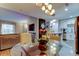 Inviting dining area featuring a glass table, modern lighting, and an open floor plan at 9481 Highland Oak Dr # 1308, Tampa, FL 33647
