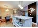 Kitchen island with seating opens to the dining and living area at 9481 Highland Oak Dr # 1308, Tampa, FL 33647