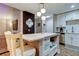 Kitchen island with seating opens to the dining and living area at 9481 Highland Oak Dr # 1308, Tampa, FL 33647