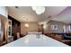 This open kitchen features a large island with bar seating, modern lighting, and an adjacent living area at 9481 Highland Oak Dr # 1308, Tampa, FL 33647