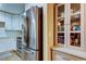 Bright kitchen with stainless-steel refrigerator and updated white cabinets at 9481 Highland Oak Dr # 1308, Tampa, FL 33647