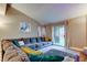 Spacious living room with comfortable seating and sliding glass doors to the exterior at 9481 Highland Oak Dr # 1308, Tampa, FL 33647