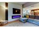 Stylish living room featuring a modern fireplace, sleek TV, and comfortable seating at 9481 Highland Oak Dr # 1308, Tampa, FL 33647