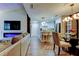 Open concept living space connecting the living room, dining area, and modern kitchen at 9481 Highland Oak Dr # 1308, Tampa, FL 33647