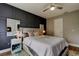 This main bedroom features a decorative wall, a ceiling fan, and and lighted mirrors at 9481 Highland Oak Dr # 1308, Tampa, FL 33647