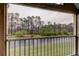 Enjoy the view of the pond and lush landscaping from this screened patio at 9481 Highland Oak Dr # 1308, Tampa, FL 33647