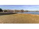 Tranquil waterfront with a wooden dock, offering peaceful views and outdoor enjoyment at 9481 Highland Oak Dr # 1308, Tampa, FL 33647